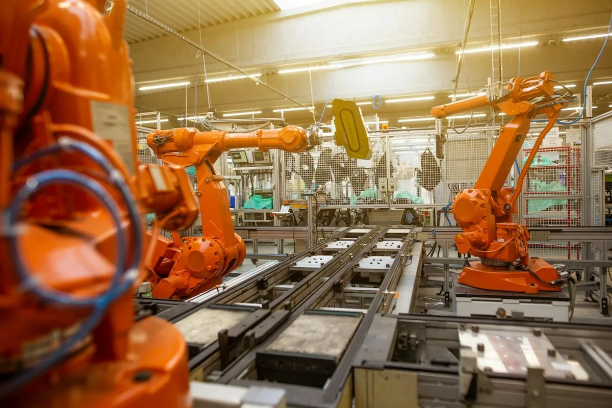 Industrial robotic arms on a manufacturing line